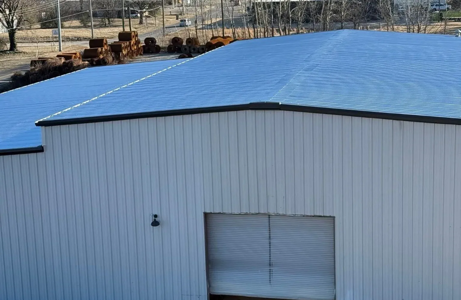 Completed metal roof on large commercial warehouse