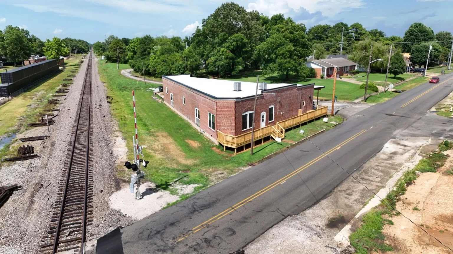 Finished commercial building alongside railroad