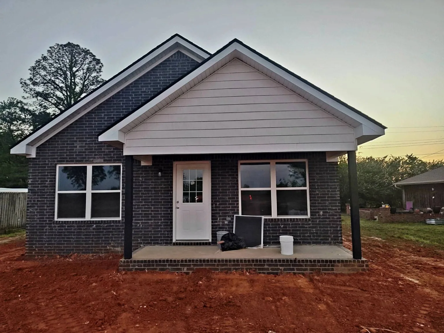 Completed dark-brick new home front
