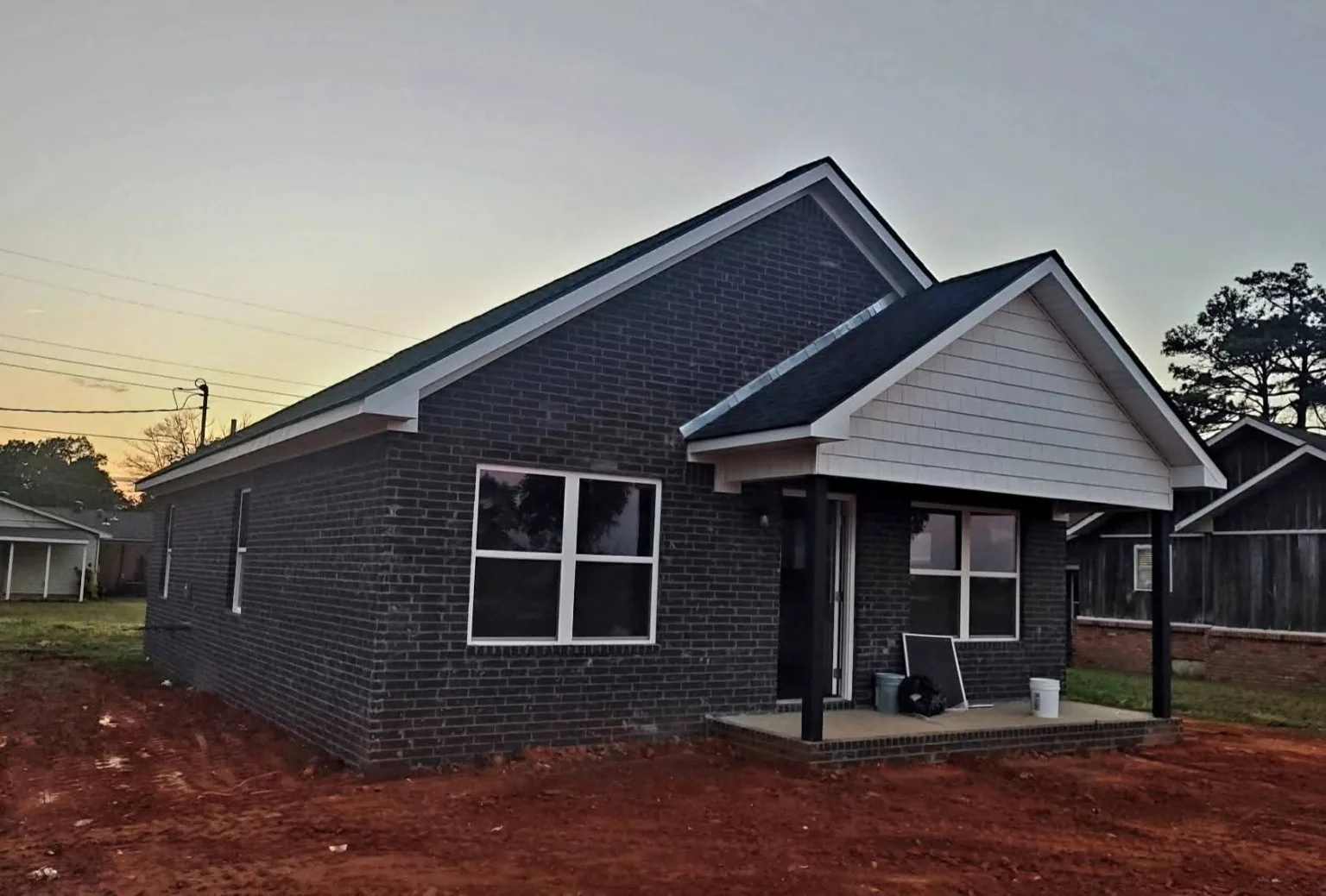 Dark brick home side exterior