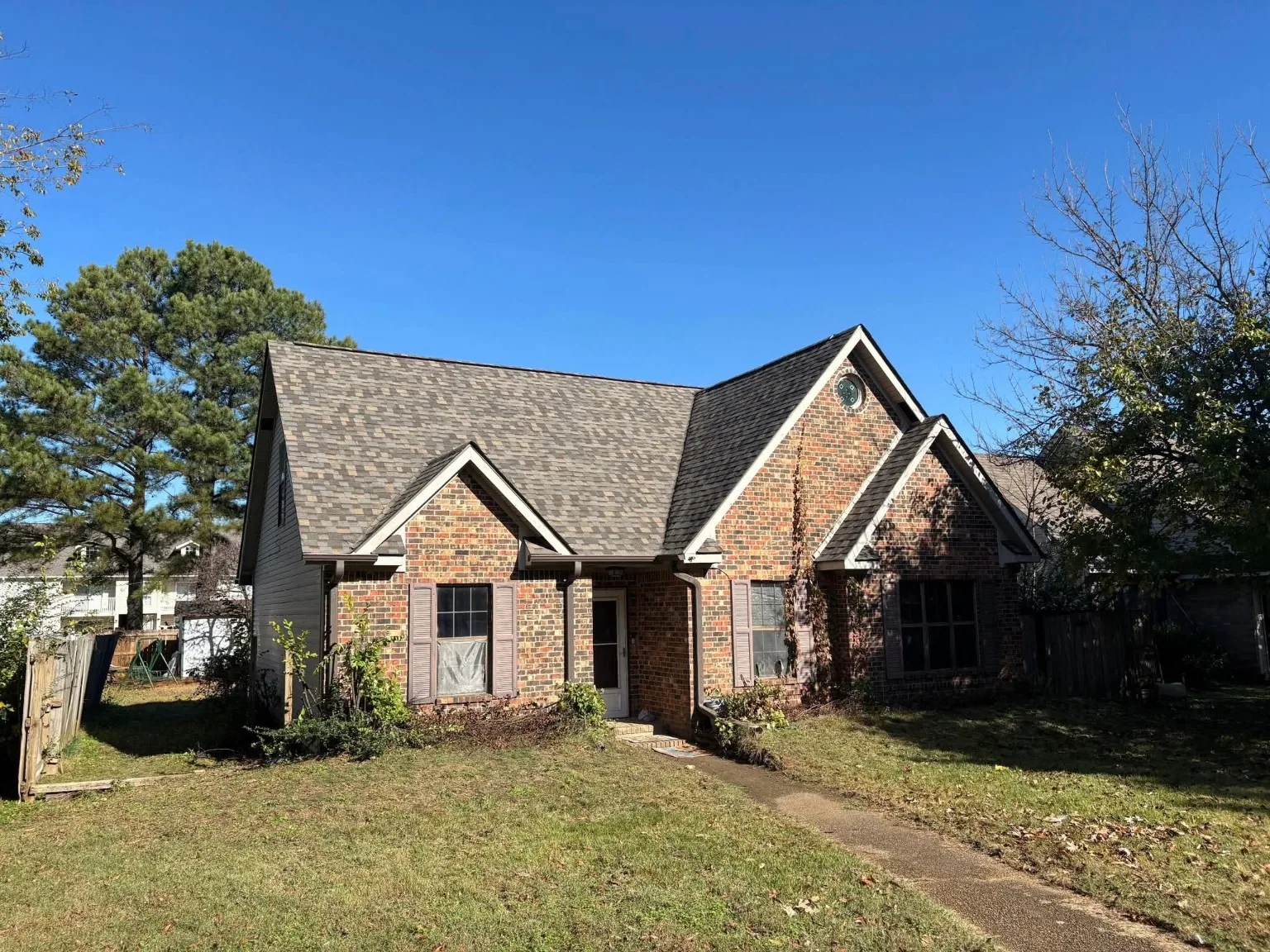 Residential brick home shingle roof
