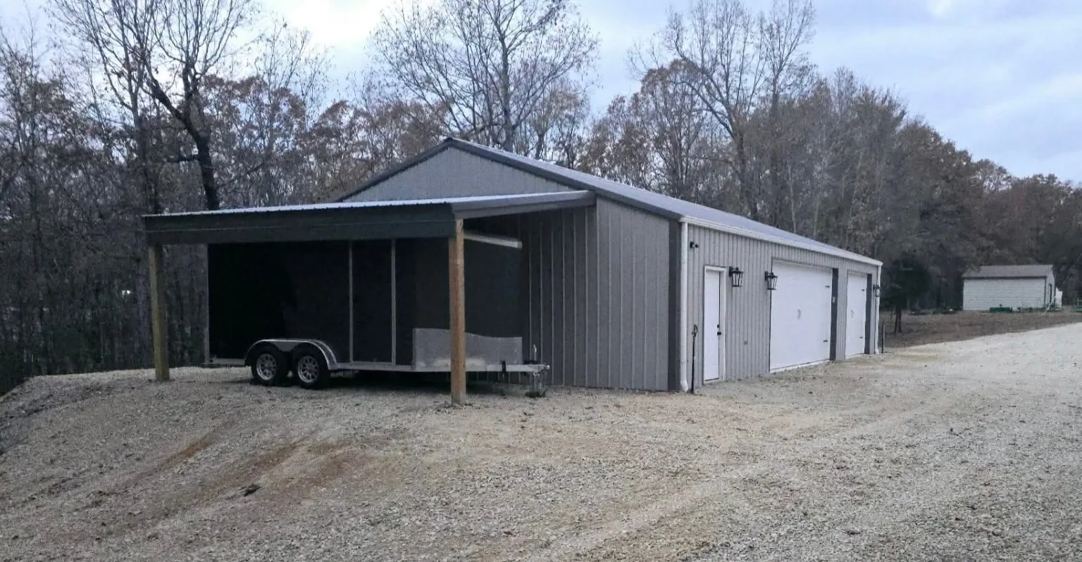 Gray shop and covered trailer parking bay
